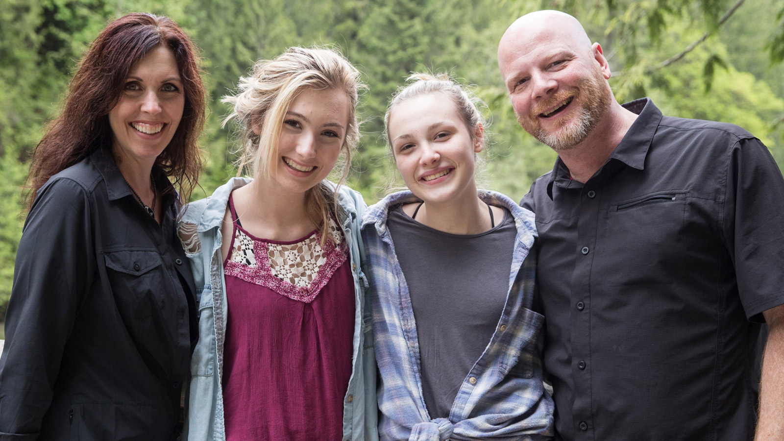 Foster family takes a photo together.