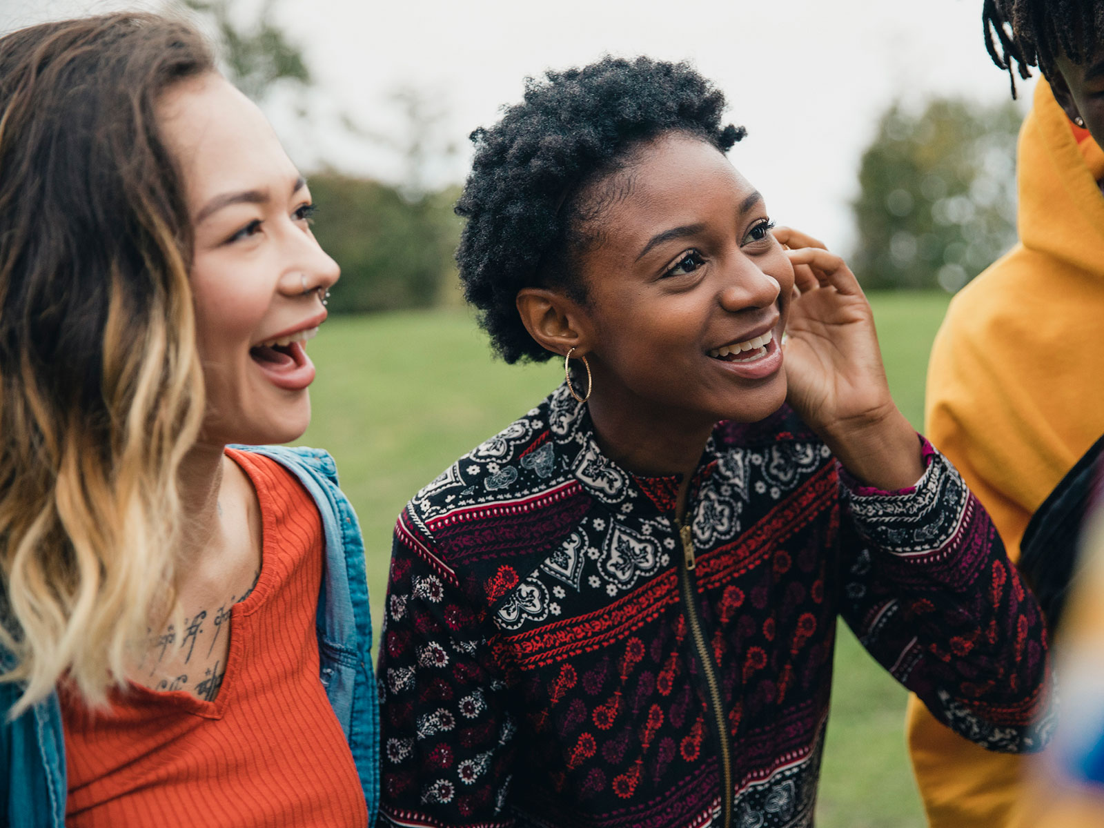 A group of foster kids smile and laugh.
