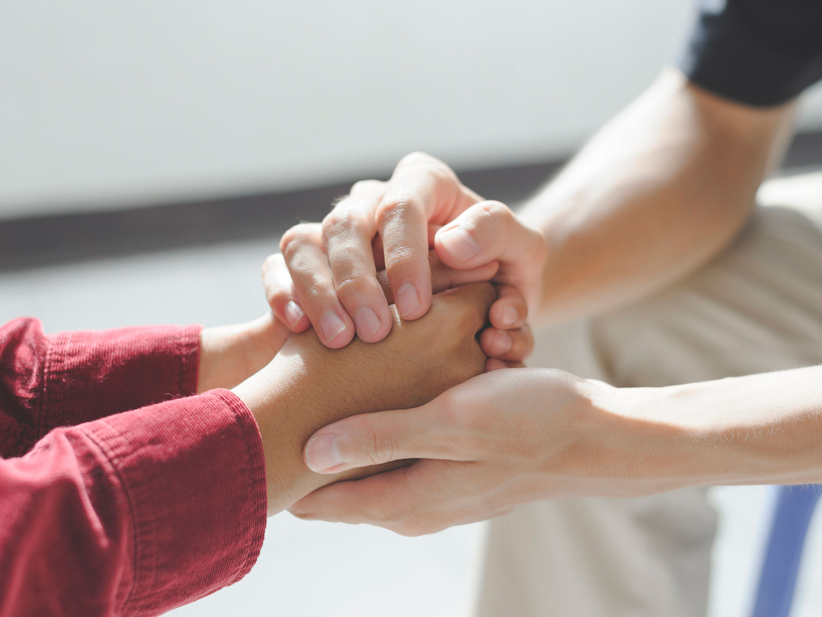 Two people shake hands