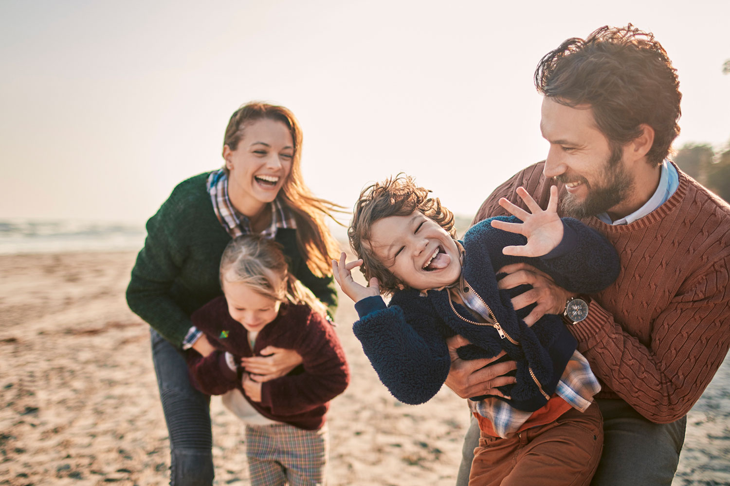Foster family spends time together at the beach.